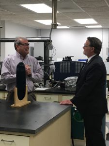 Senator Peters speaking to Dr. Tom Guarr in his research lab