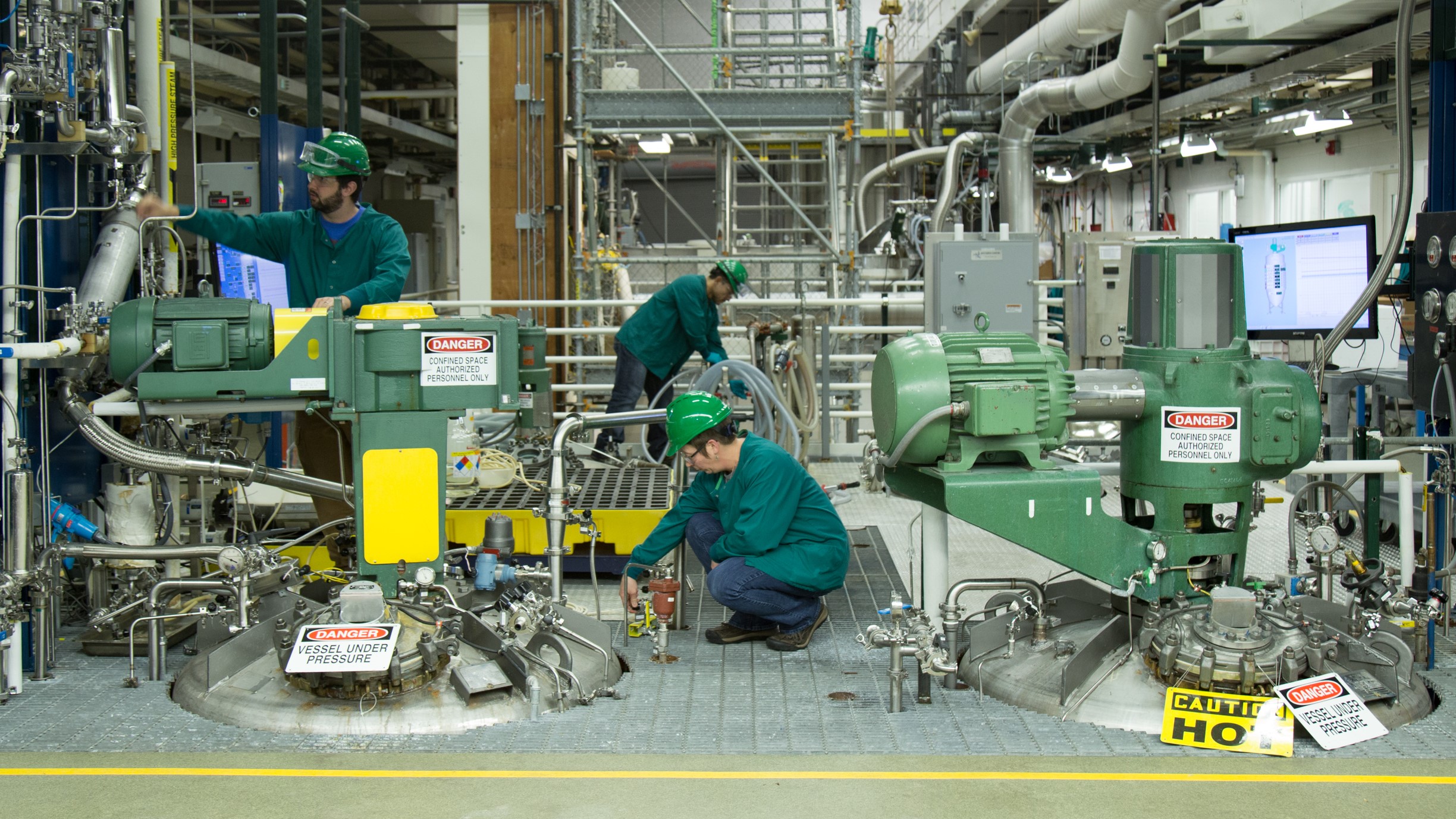 Scientists working near 3000L Vessels