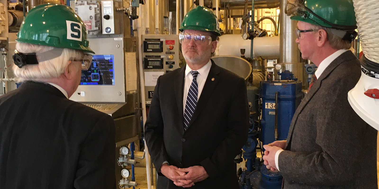 Senator Gary Peters and others during a tour of scale up plant